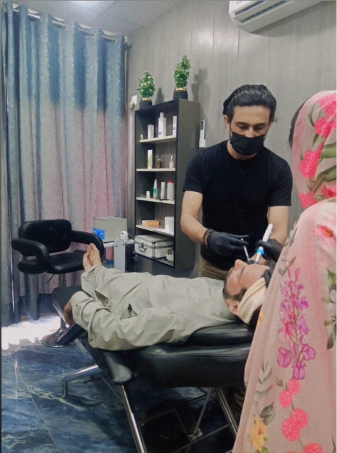 Doctor Performing Aesthetic Facial Treatment Procedure