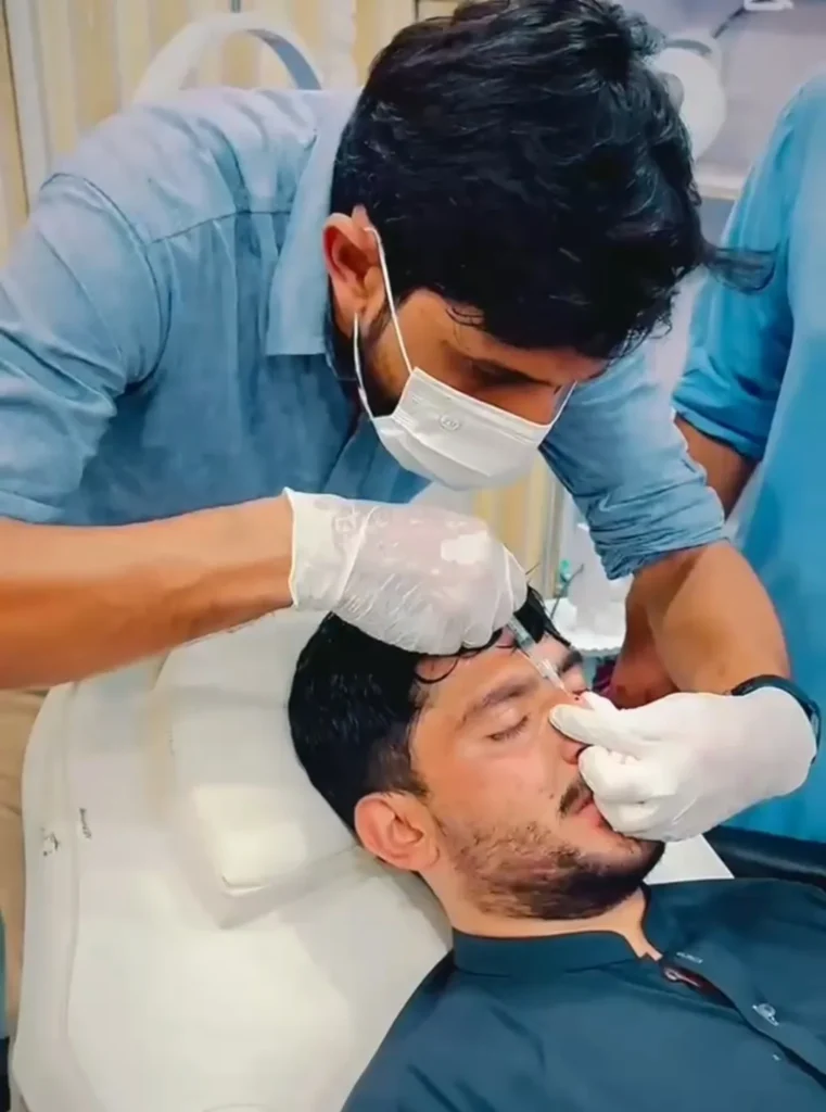 Doctor Performing Injectable Dermal Filler Treatment