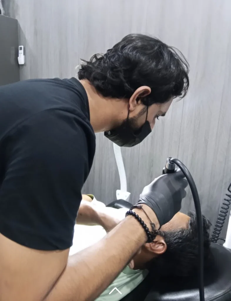 Doctor Performing Laser Facial Skin Treatment